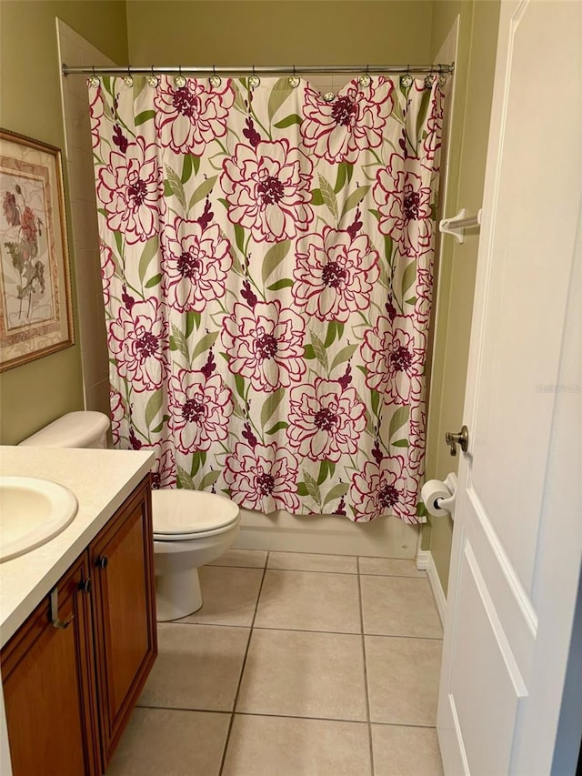 full bathroom featuring toilet, shower / tub combo, vanity, and tile patterned floors