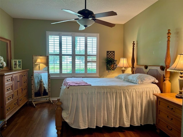 bedroom featuring ceiling fan and dark hardwood / wood-style floors