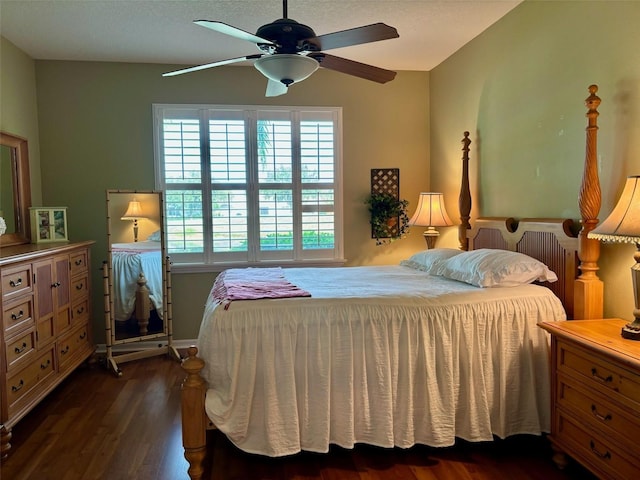 bedroom featuring ceiling fan and dark hardwood / wood-style floors