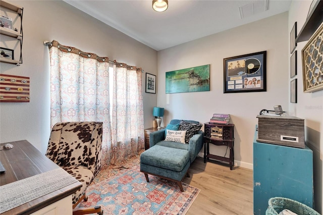 sitting room with light hardwood / wood-style flooring