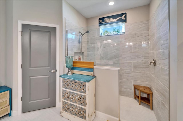 bathroom with a tile shower