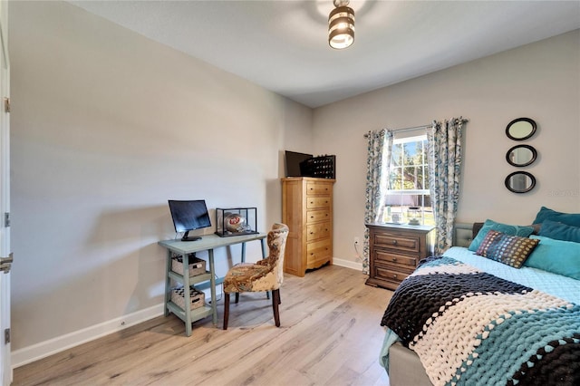 bedroom with light wood-type flooring