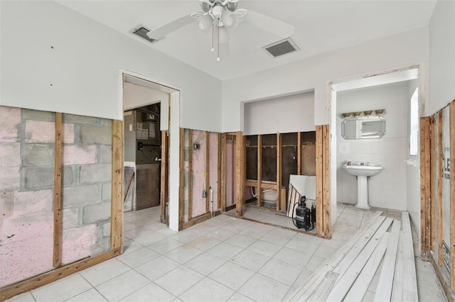 interior space featuring sink and ceiling fan