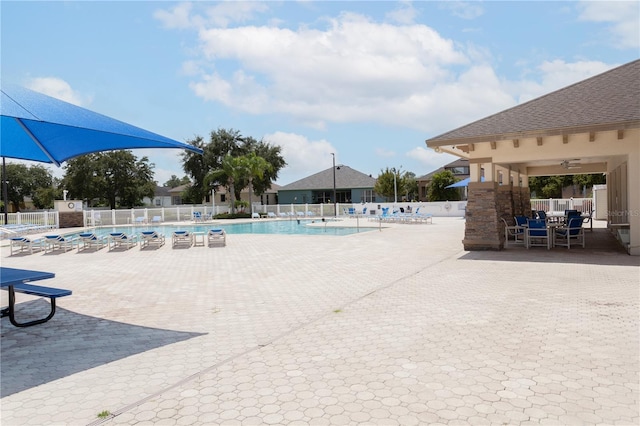 view of pool with ceiling fan and a patio area