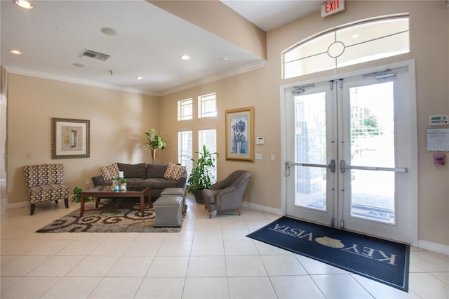 interior space with ornamental molding and french doors