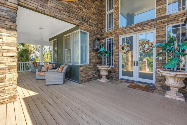 wooden deck featuring french doors