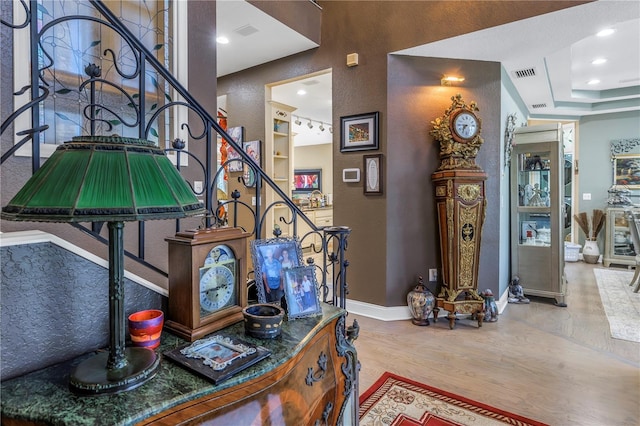 stairway with hardwood / wood-style floors