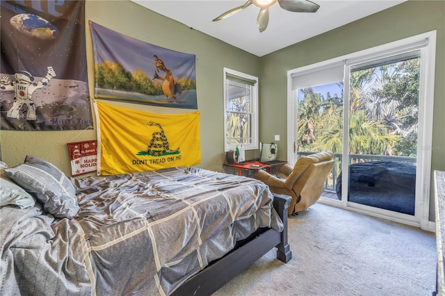 carpeted bedroom featuring access to exterior and ceiling fan