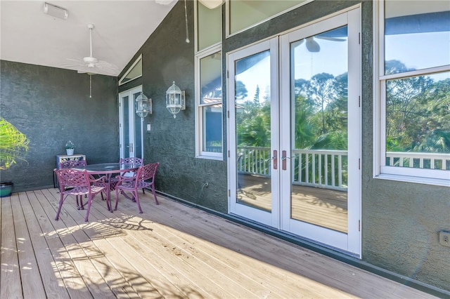 deck featuring ceiling fan and french doors