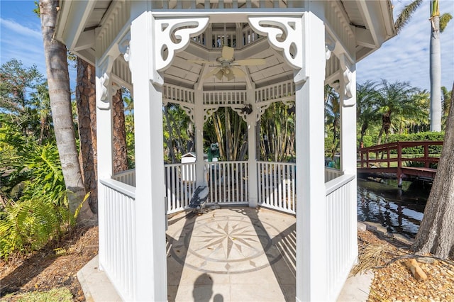 view of patio with ceiling fan and a gazebo