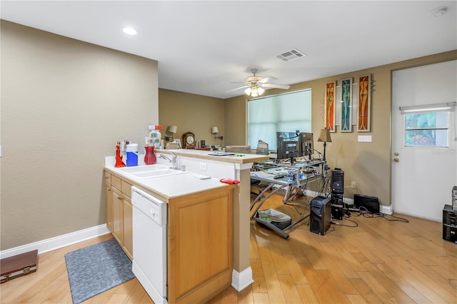 kitchen featuring sink, light hardwood / wood-style flooring, kitchen peninsula, and white dishwasher