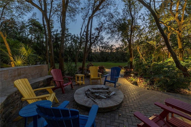 patio terrace at dusk with a fire pit