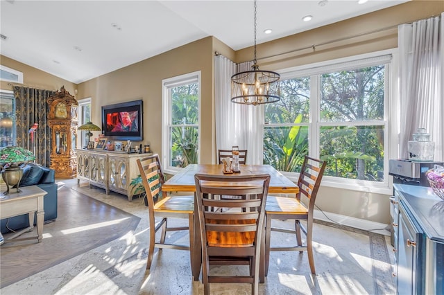 dining room featuring lofted ceiling, recessed lighting, visible vents, an inviting chandelier, and baseboards