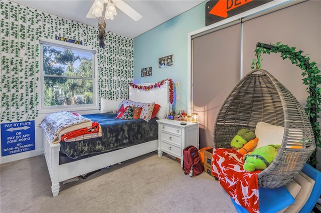 bedroom with light carpet and ceiling fan