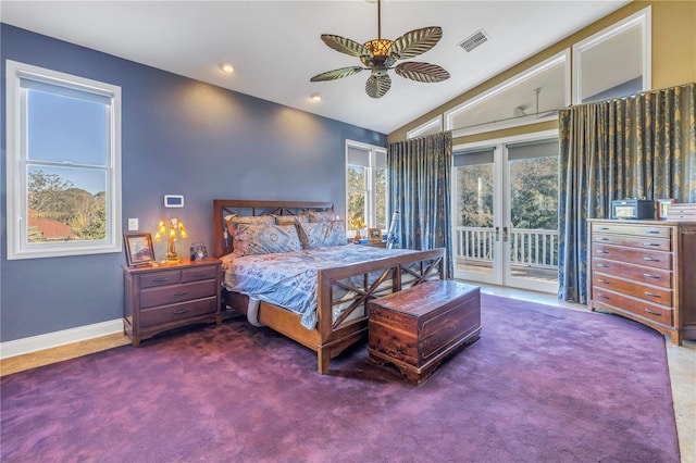 bedroom featuring lofted ceiling, visible vents, access to exterior, french doors, and dark carpet