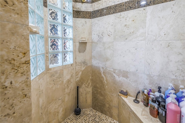 full bath featuring tiled shower