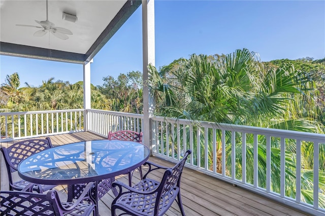 wooden deck featuring ceiling fan and outdoor dining space