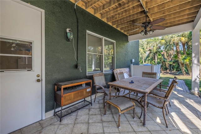 view of patio featuring outdoor dining area and ceiling fan