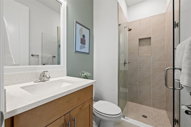 bathroom with walk in shower, tile patterned flooring, vanity, and toilet