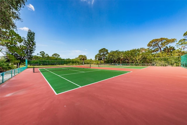 view of sport court featuring basketball hoop