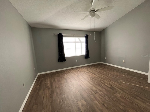 unfurnished room with ceiling fan, dark hardwood / wood-style floors, and a textured ceiling