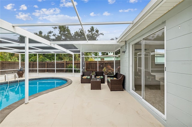 view of swimming pool with an outdoor living space, glass enclosure, and a patio