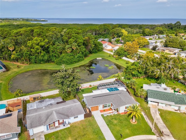 birds eye view of property with a water view