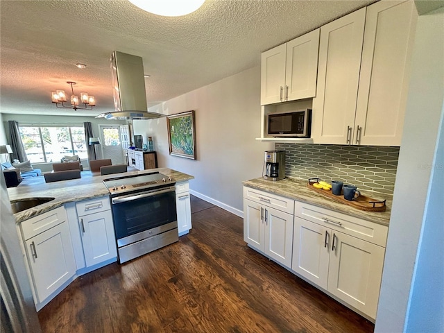 kitchen featuring white cabinetry, backsplash, island exhaust hood, a textured ceiling, and appliances with stainless steel finishes