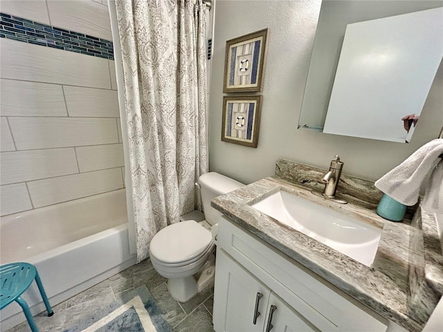 full bathroom featuring vanity, shower / bath combo, and toilet