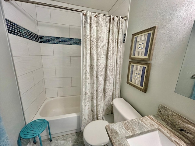 full bathroom featuring vanity, shower / tub combo, and toilet