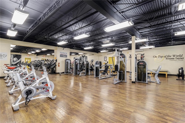 workout area with wood-type flooring