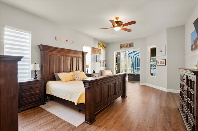 bedroom with ceiling fan and light hardwood / wood-style floors