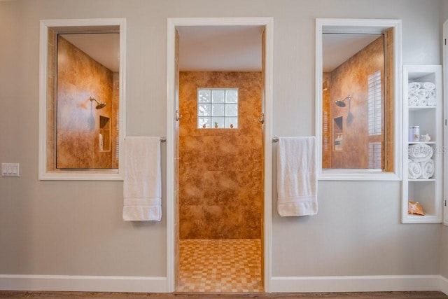 bathroom featuring a tile shower