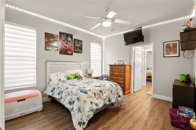 bedroom featuring ceiling fan and hardwood / wood-style floors