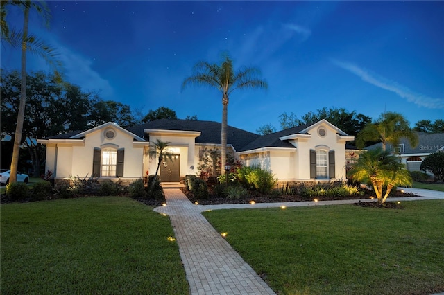 6020 Kestrel Point Ave, Lithia, FL 33547 - view of front facade featuring stucco siding, a front yard, and stone siding