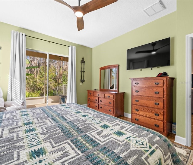 bedroom with ceiling fan and wood-type flooring