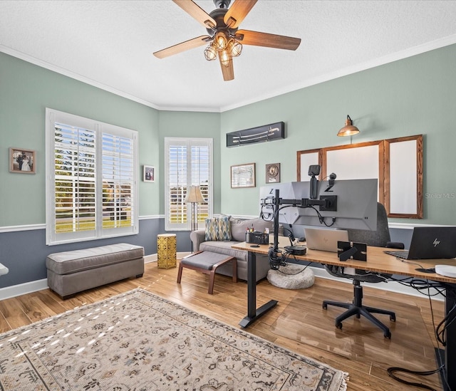 office area featuring hardwood / wood-style floors, ceiling fan, crown molding, and a textured ceiling