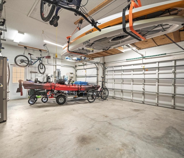 garage with stainless steel refrigerator