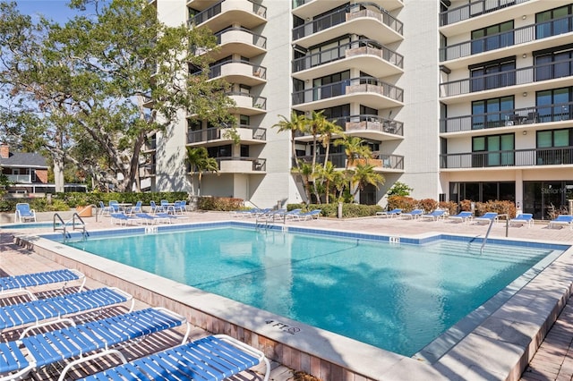 view of swimming pool with a patio