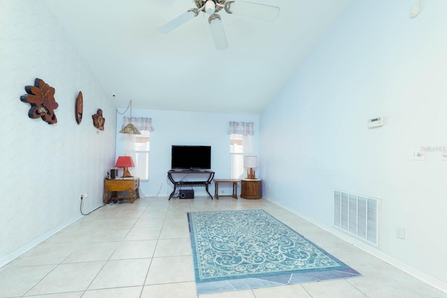 tiled living room with ceiling fan