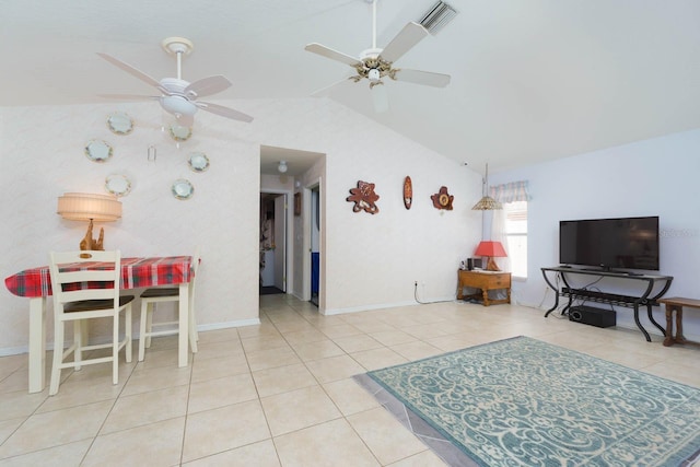 tiled living room with ceiling fan and vaulted ceiling