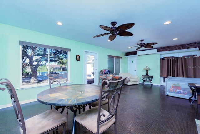 dining area featuring ceiling fan and a wall mounted air conditioner