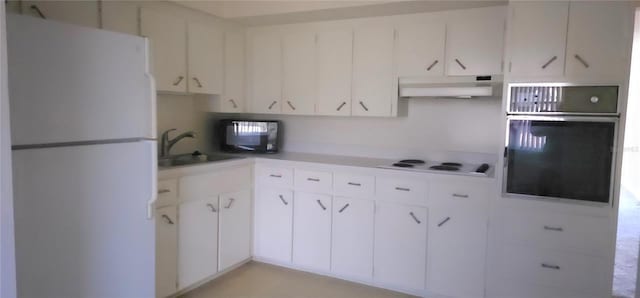 kitchen featuring white cabinetry, sink, and white appliances