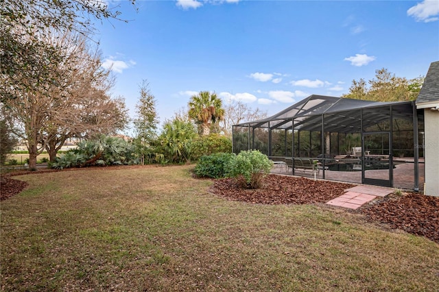 view of yard with glass enclosure