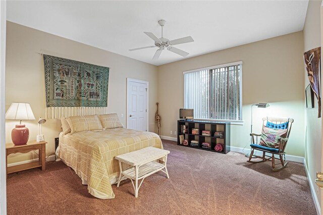 bedroom with a ceiling fan, carpet, and baseboards