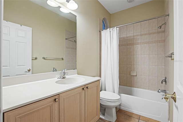 full bath featuring vanity, tile patterned floors, toilet, and shower / bath combo