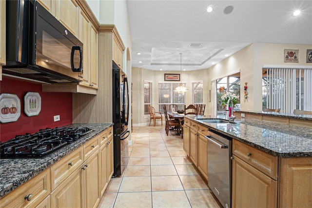 kitchen with black appliances, light tile patterned flooring, recessed lighting, and a sink