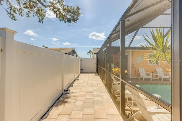 view of home's exterior with a patio and a lanai