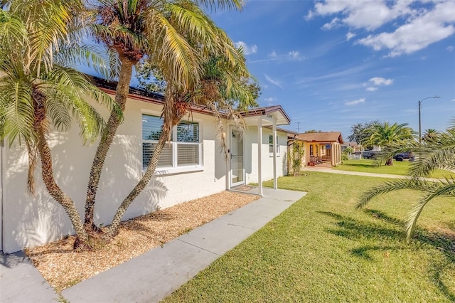 exterior space with a front lawn