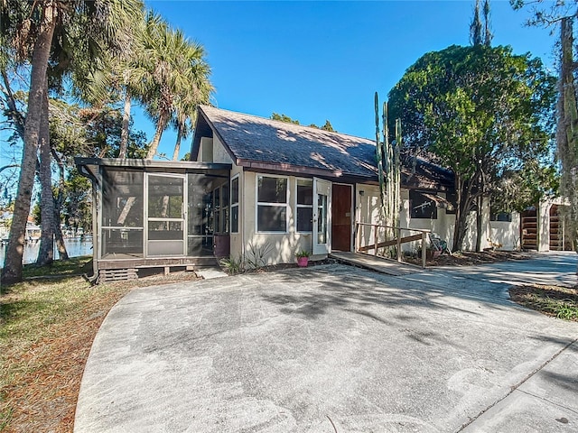 back of property featuring a sunroom